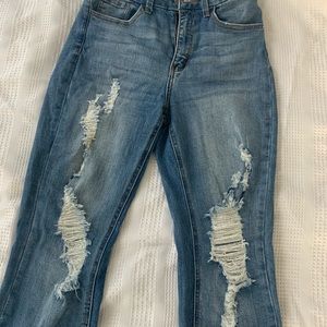 High rise distressed jeans. Size 5. New w/tags